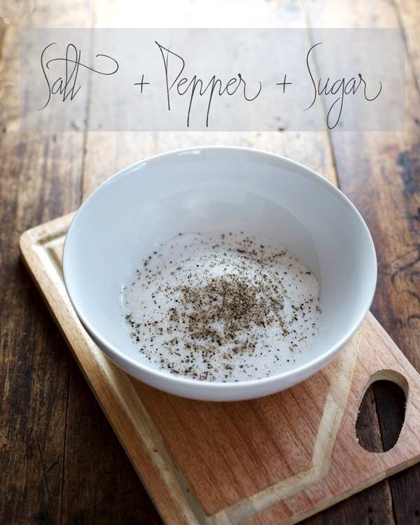 Salt, pepper, and sugar in a white bowl.