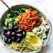 A picture of Mediterranean Quinoa Bowls with Roasted Red Pepper Sauce
