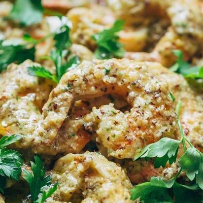 Spanish Shrimp with Garlic Bread Sauce in a pan with parsley.