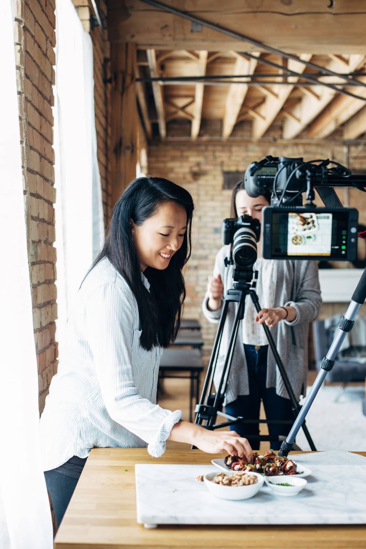 Women working to make a recipe video.