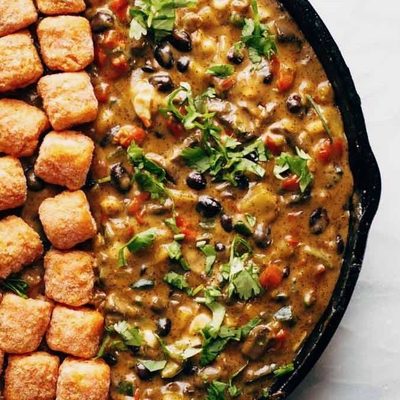 Sweet Potato Tater Tot Hotdish in a skillet before baking.