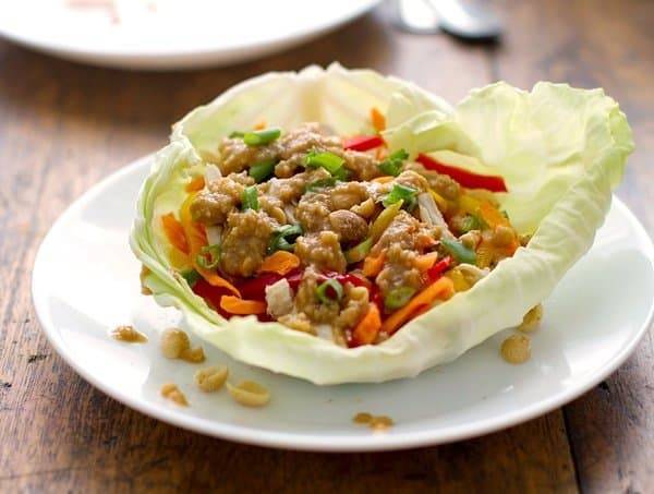 Thai chicken lettuce wraps on a plate.
