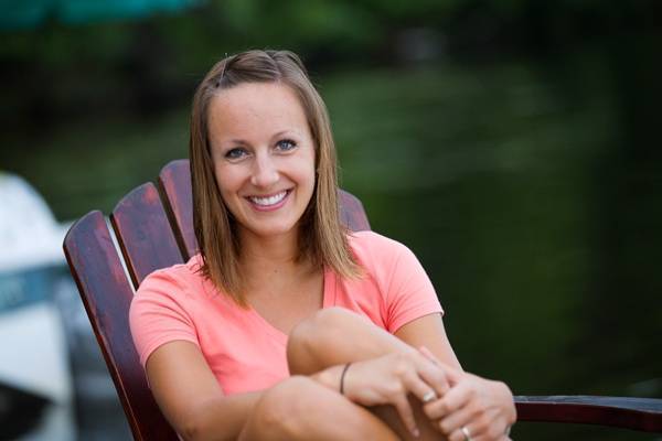 Woman relaxing on a chair with a smile.