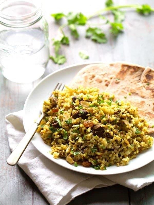 Beef Biryani - slivered almonds, golden raisins, saucy beef, warm spices, and fragrant basmati rice. ❤ le sigh. | pinchofyum.com