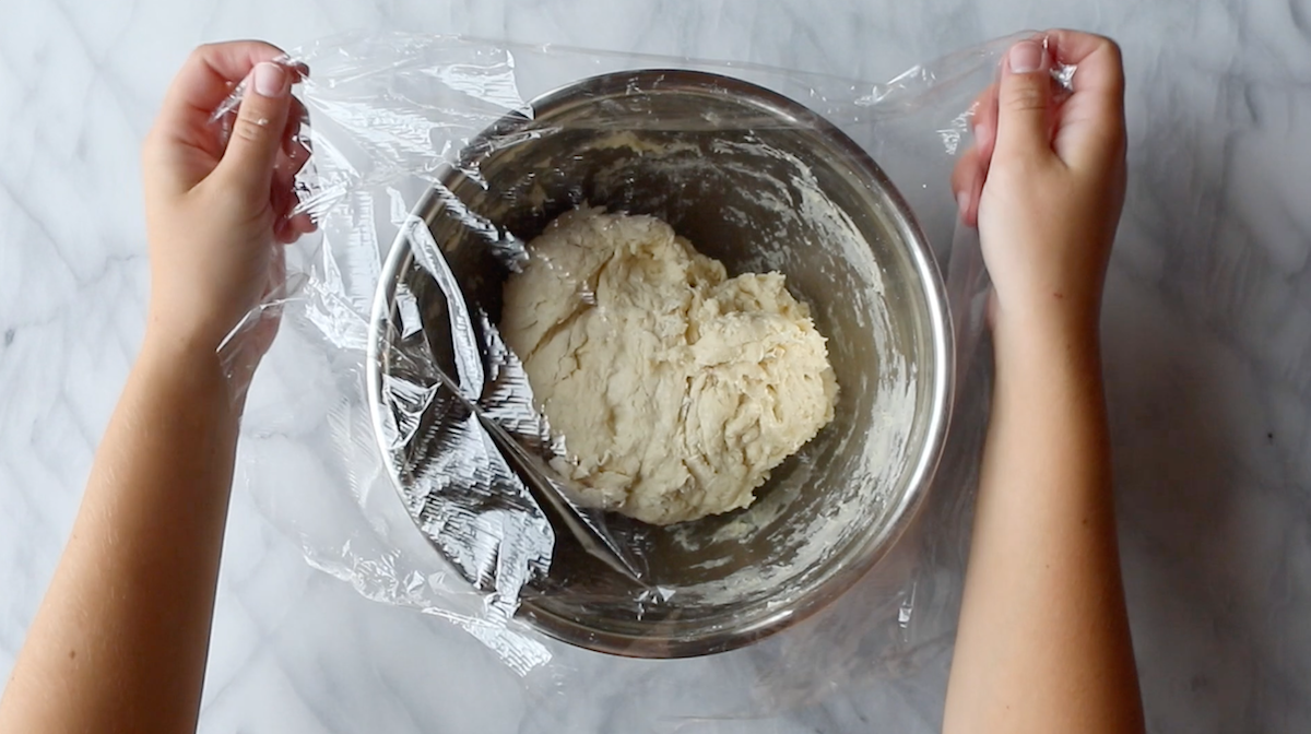 Resting dough in covered bowl.
